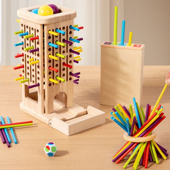 A variety of wooden Montessori toys including a colorful stick tower game and sorting tools on a wooden table.