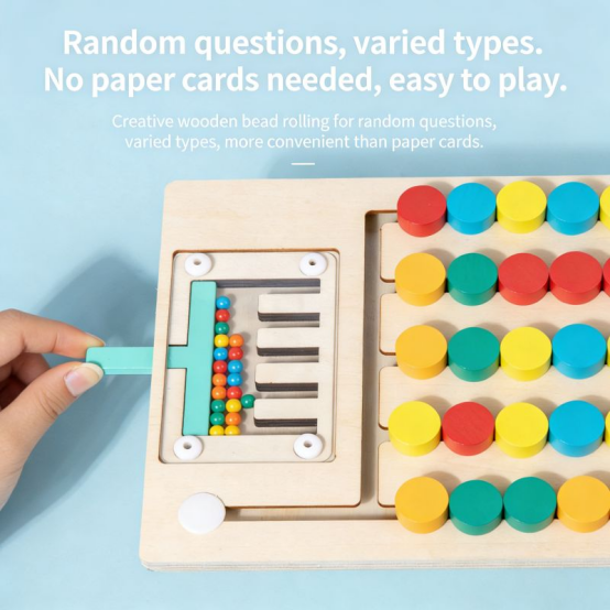 Hand playing a wooden balancing game with colorful sticks, classic Montessori toys for kids.